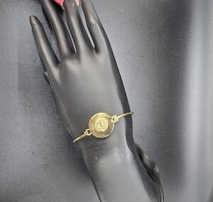 Marc by Marc Jacob's Gold-tone Disk Bracelet.